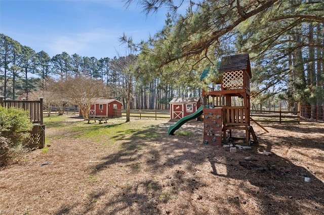 view of jungle gym with a storage unit