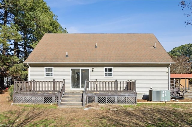 back of house with a wooden deck and central AC