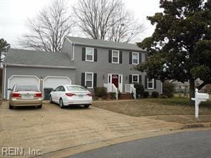 colonial-style house featuring a garage