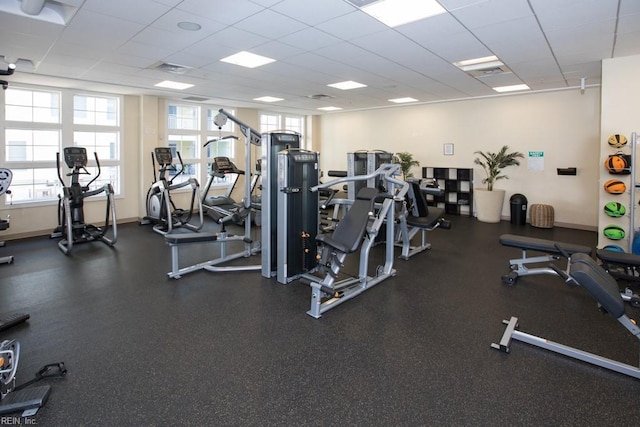 workout area with a paneled ceiling