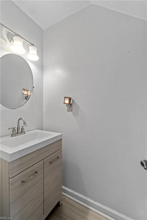 bathroom featuring vanity and hardwood / wood-style floors