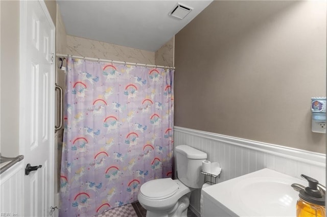 bathroom with vanity, toilet, and a shower with curtain