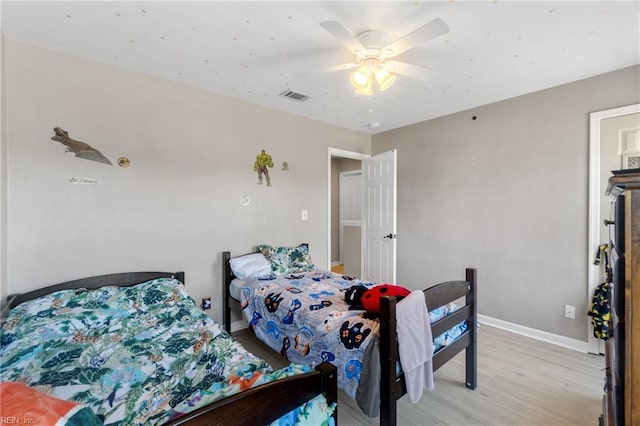 bedroom with ceiling fan and light hardwood / wood-style flooring