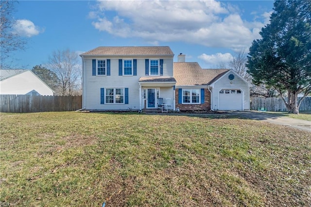 view of front of home featuring a garage and a front yard