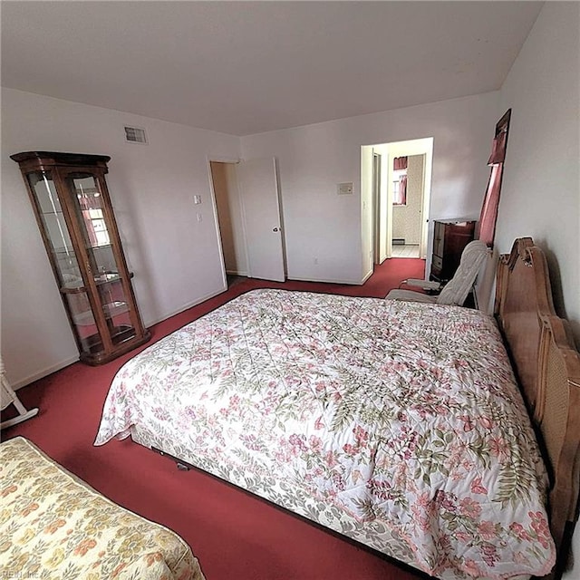 bedroom featuring carpet floors and visible vents