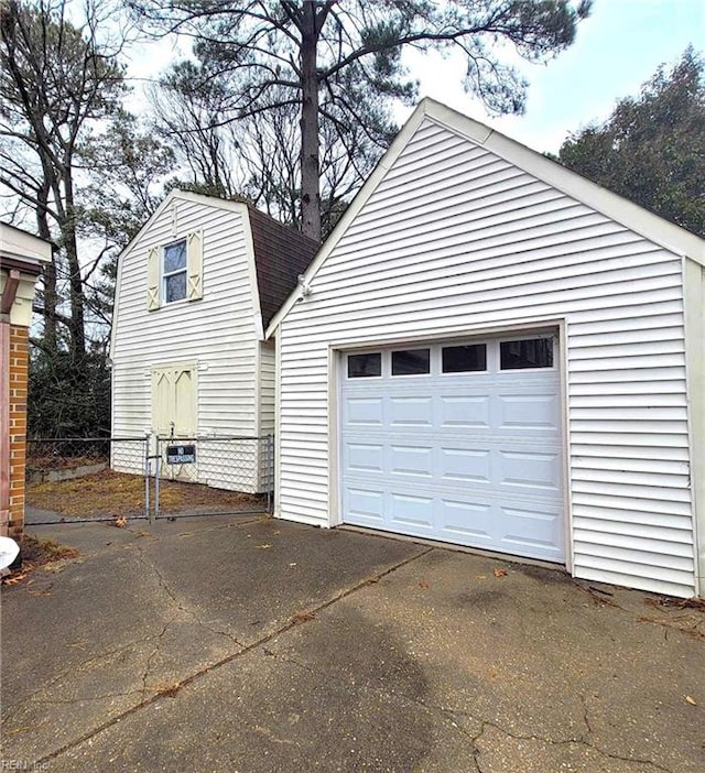 detached garage featuring driveway