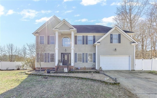 view of front of house featuring a garage and a front yard