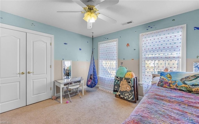 carpeted bedroom featuring ceiling fan