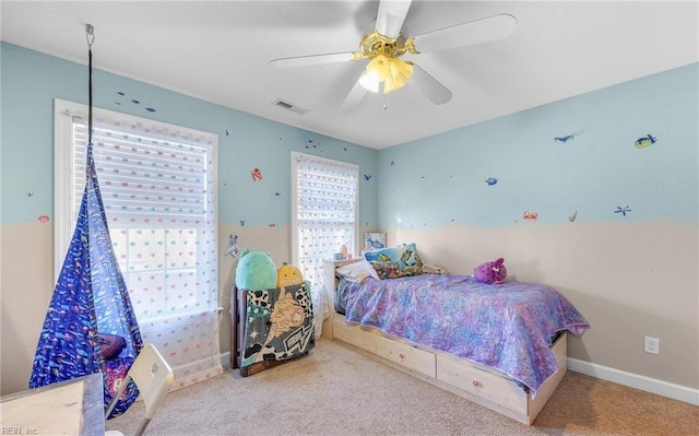 bedroom featuring ceiling fan and carpet