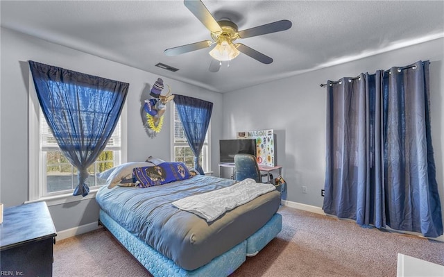 bedroom with ceiling fan and carpet flooring