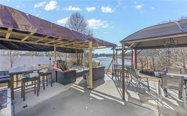 view of patio with an outdoor hangout area and a water view