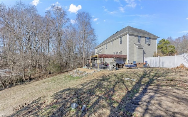 rear view of house with a yard