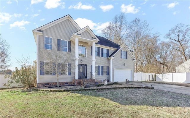 view of front of home with a garage and a front yard