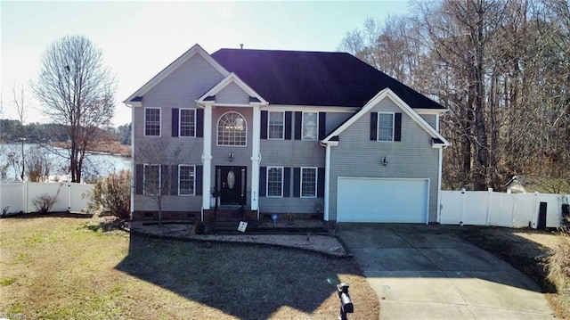 view of front facade with a garage and a front yard