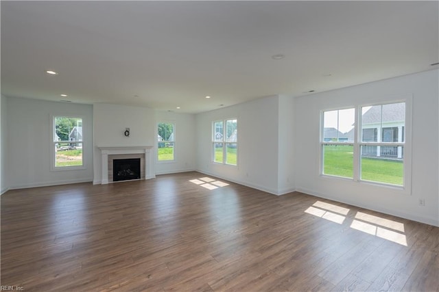 unfurnished living room featuring dark hardwood / wood-style flooring
