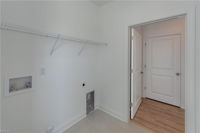 laundry room with hookup for an electric dryer, hookup for a washing machine, and light hardwood / wood-style flooring