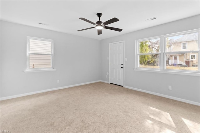 empty room with light carpet and ceiling fan