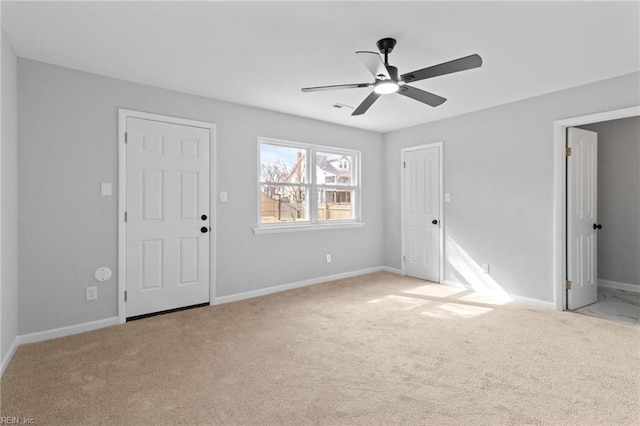 empty room with light carpet and ceiling fan