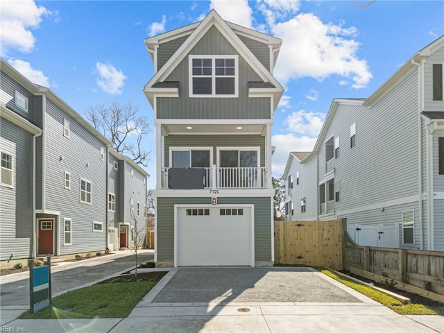 view of front of property featuring a balcony and a garage