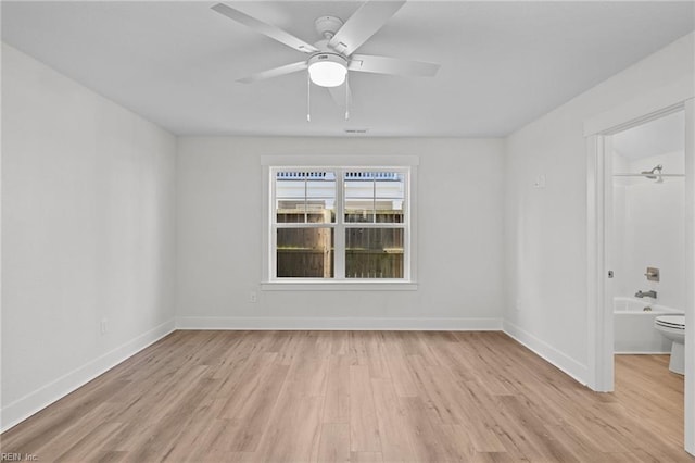 unfurnished room featuring light hardwood / wood-style floors and ceiling fan