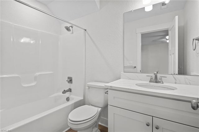 full bathroom with vanity, tub / shower combination, and toilet