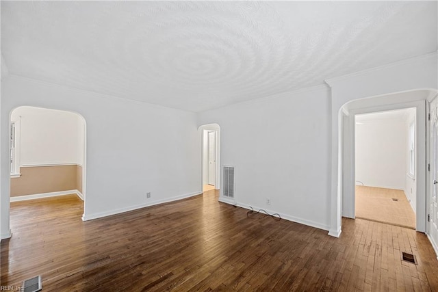 interior space with crown molding and hardwood / wood-style floors