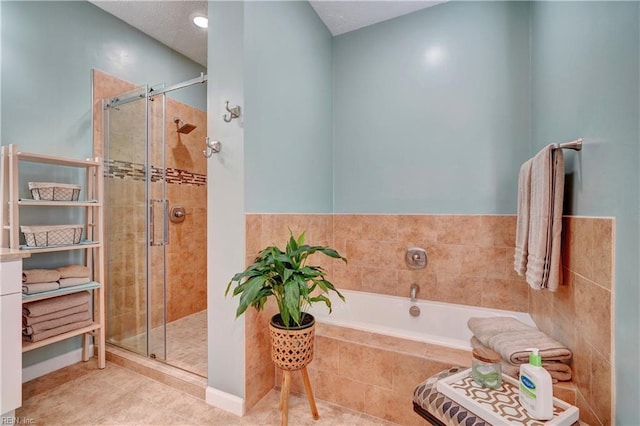 bathroom featuring tile patterned flooring and plus walk in shower