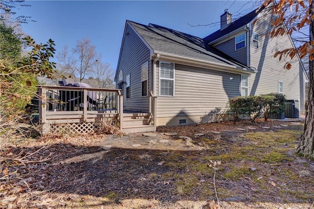 view of home's exterior featuring cooling unit and a deck