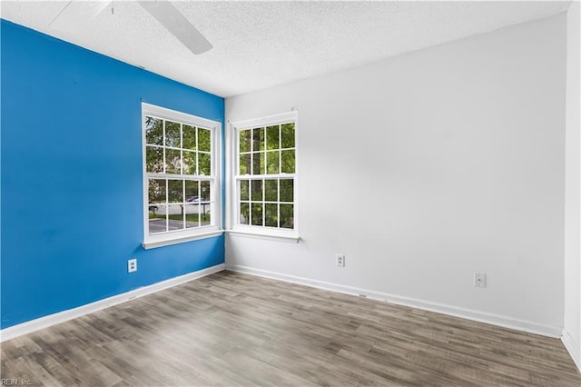 107 Marshall Way Unit J, Williamsburg, VA 23185 - unfurnished room with ceiling fan, wood finished floors, a textured ceiling, and baseboards