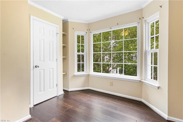 107 Marshall Way Unit J, Williamsburg, VA 23185 - spare room featuring dark wood-style flooring, crown molding, and baseboards