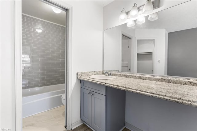 107 Marshall Way Unit J, Williamsburg, VA 23185 - full bathroom with vanity, toilet, marble look tiles, and bathtub / shower combination