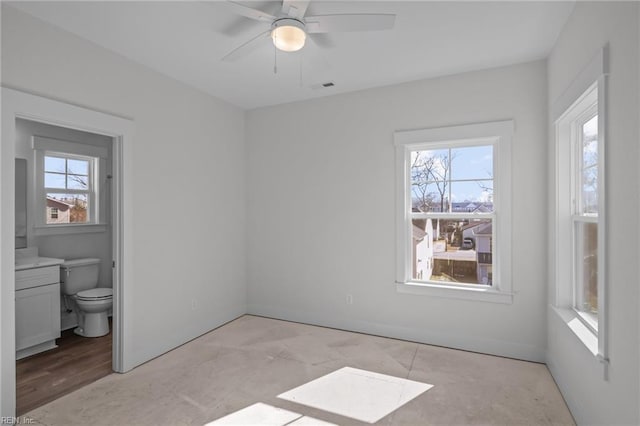 unfurnished bedroom featuring ensuite bathroom