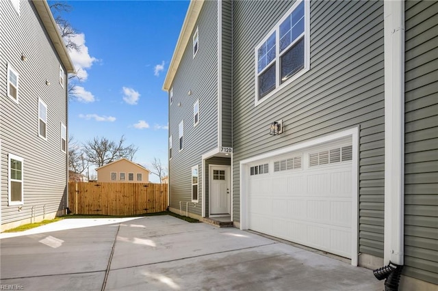 view of property exterior featuring a garage