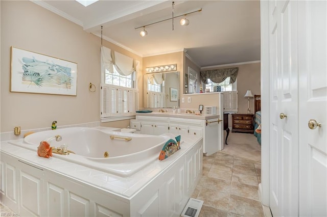 bathroom featuring ornamental molding, a bath, and vanity