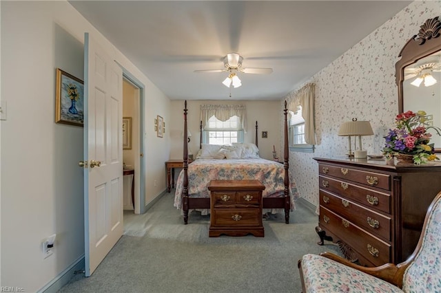 bedroom with light carpet and ceiling fan