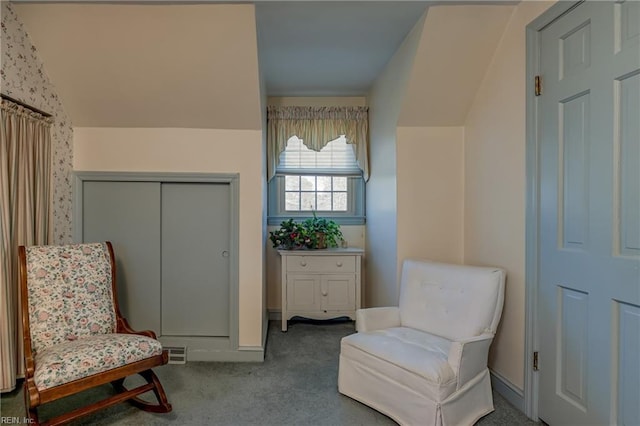 sitting room featuring carpet flooring