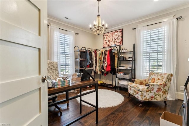 office space featuring an inviting chandelier, dark wood-type flooring, and ornamental molding