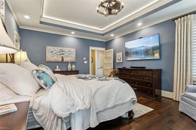 bedroom featuring a raised ceiling, crown molding, a notable chandelier, and dark hardwood / wood-style flooring