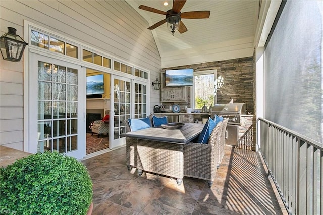 sunroom with vaulted ceiling and ceiling fan