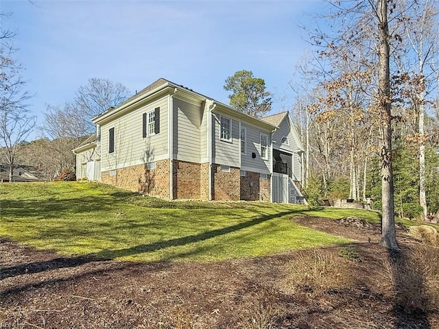 view of home's exterior with a lawn