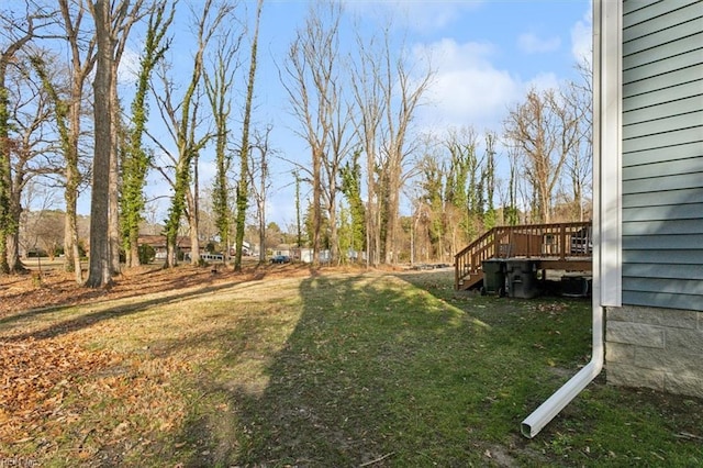 view of yard featuring a wooden deck