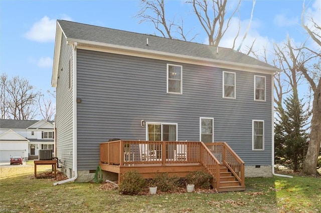 back of house featuring central AC unit, a yard, and a deck