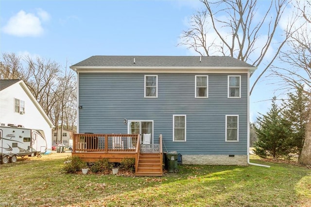 back of house featuring a yard and a deck