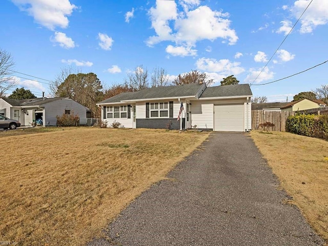 single story home with a garage and a front lawn