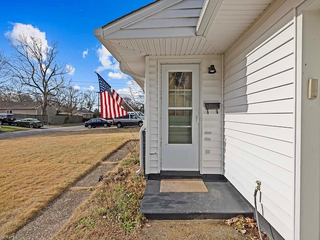 entrance to property with a yard