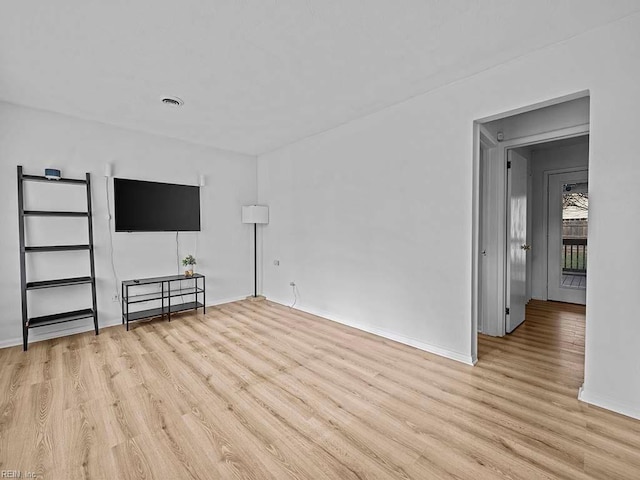 unfurnished living room with light wood-type flooring