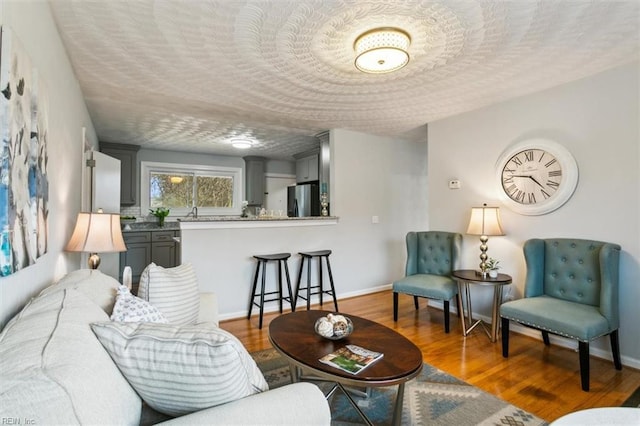 living room featuring dark hardwood / wood-style floors and a textured ceiling