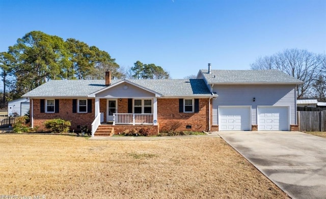 single story home with a garage, a front yard, and covered porch