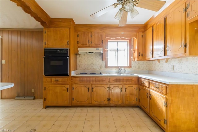 kitchen featuring white electric cooktop, sink, black oven, and ceiling fan