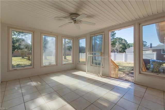 unfurnished sunroom featuring ceiling fan and wooden ceiling